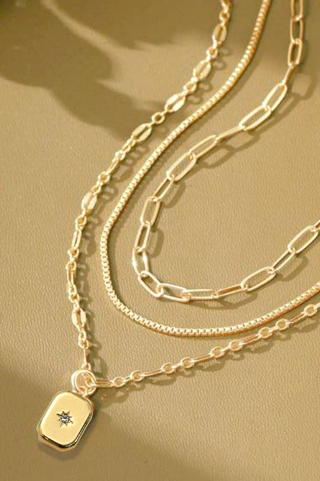 NORTH STAR TRIPLE LAYERED GOLD NECKLACE