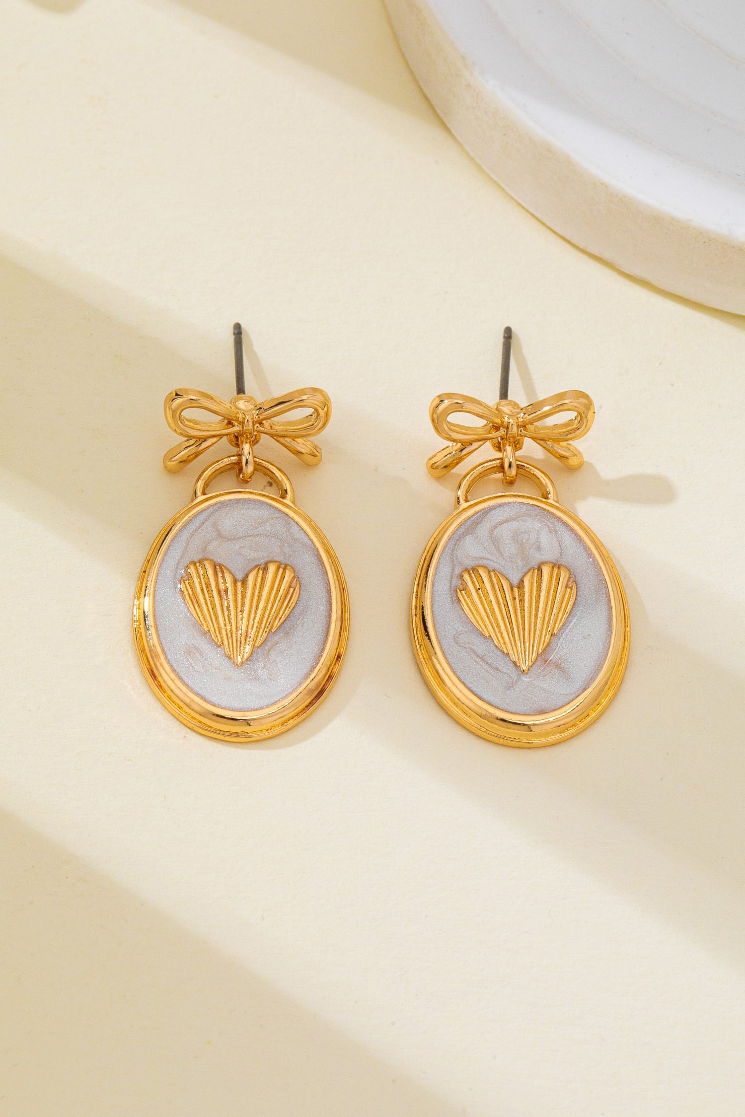 OVAL GOLD HEART BOW EARRINGS