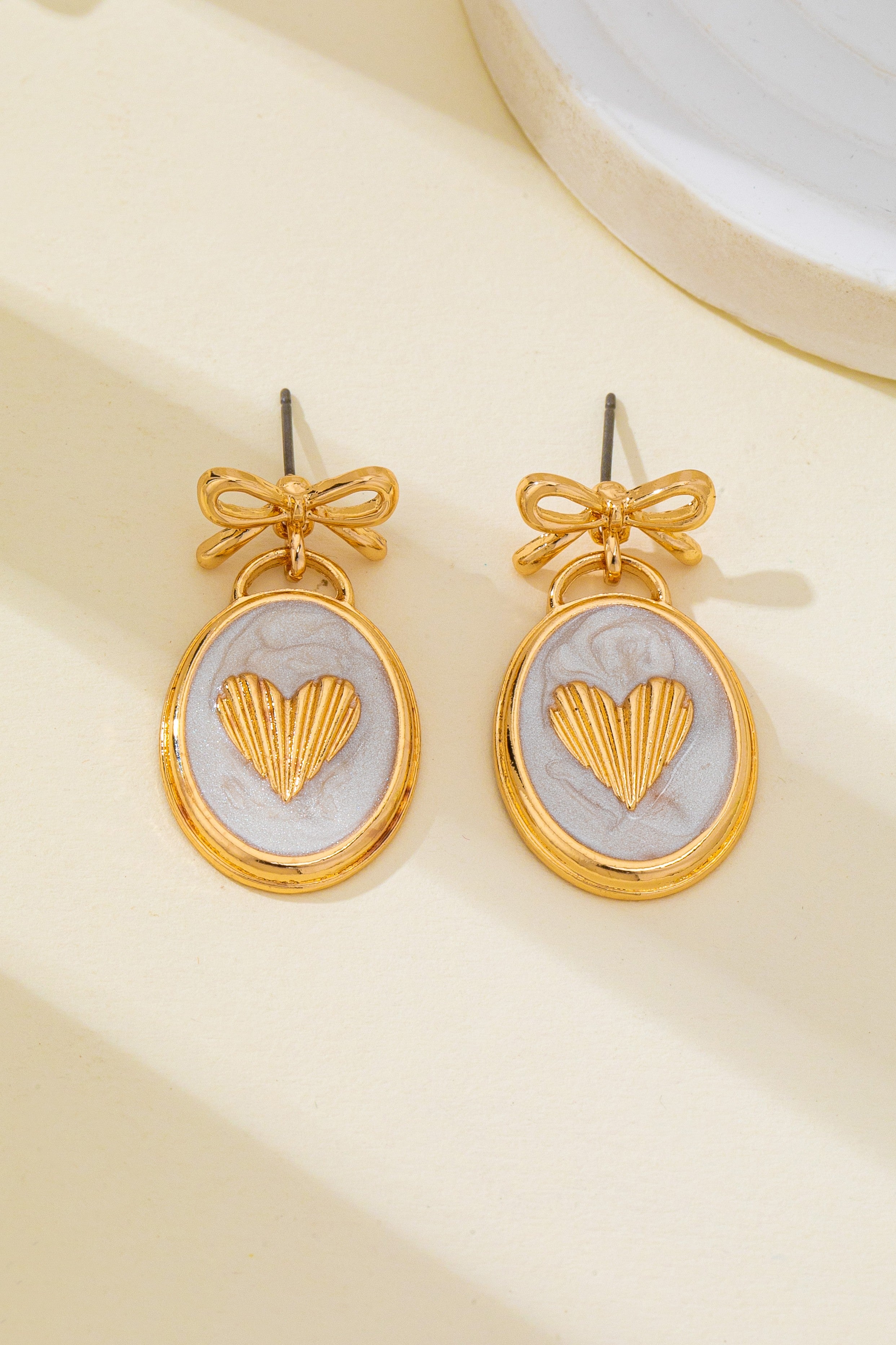 OVAL GOLD HEART BOW EARRINGS