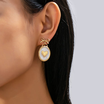 OVAL GOLD HEART BOW EARRINGS